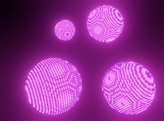 Pink spheres represent nanocrystal superlattices